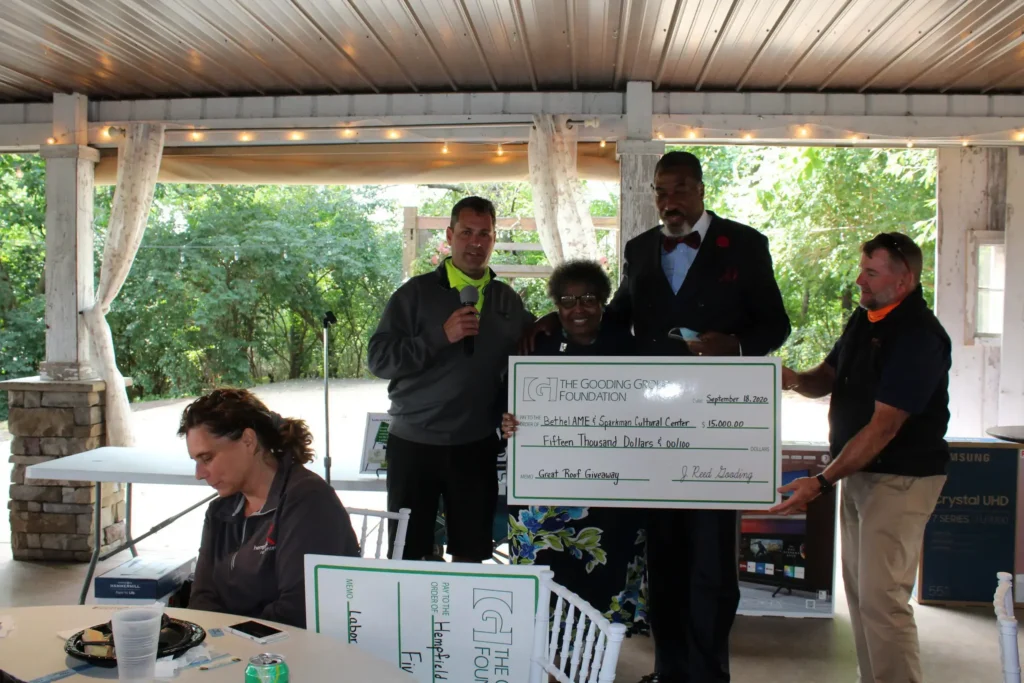 Presenting the check for the Great Roof Giveaway