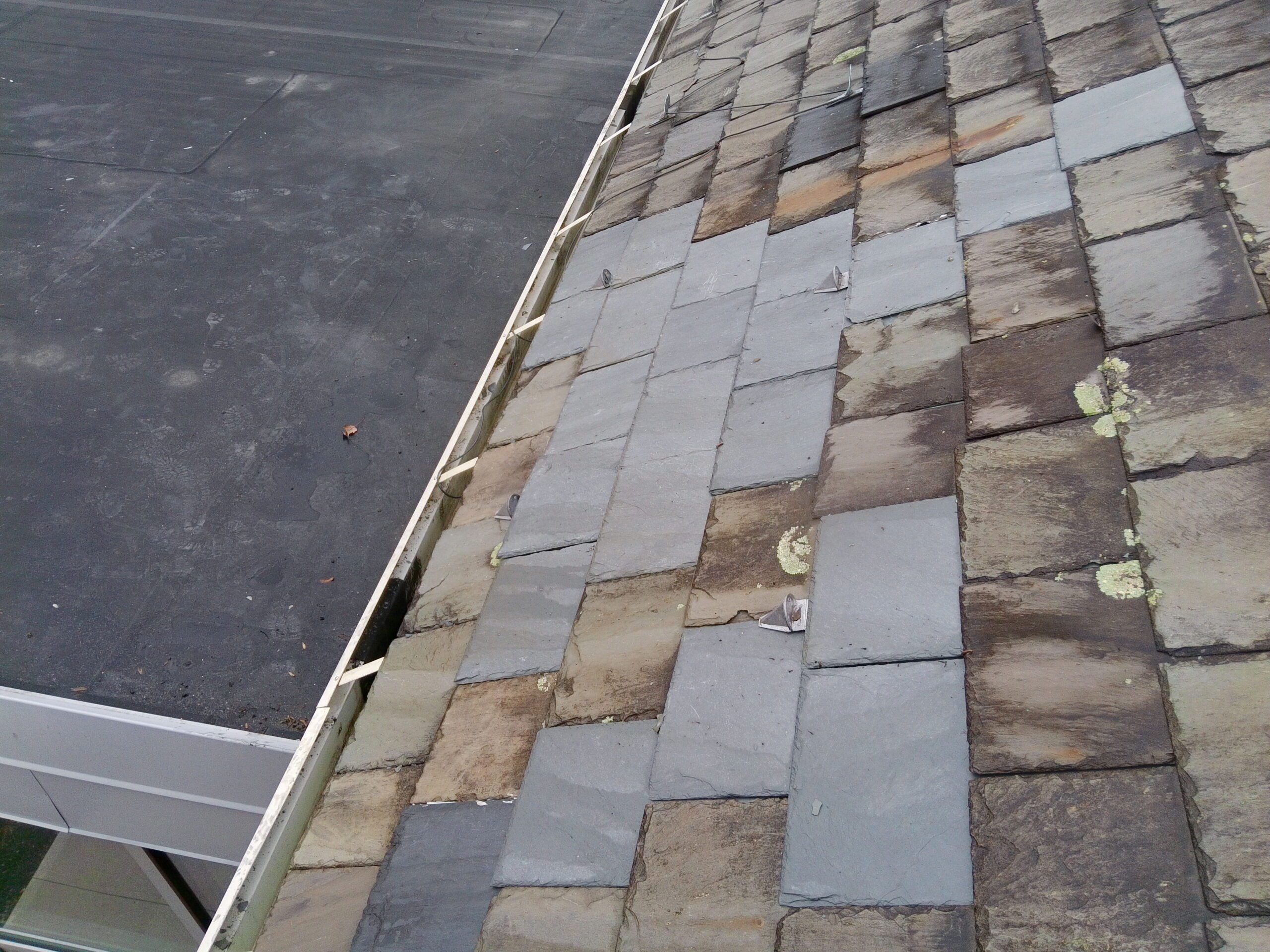 Completed Vermont Gray slate repairs with new copper snow guards at St. Matthew Roman Catholic Church in Tyrone, PA